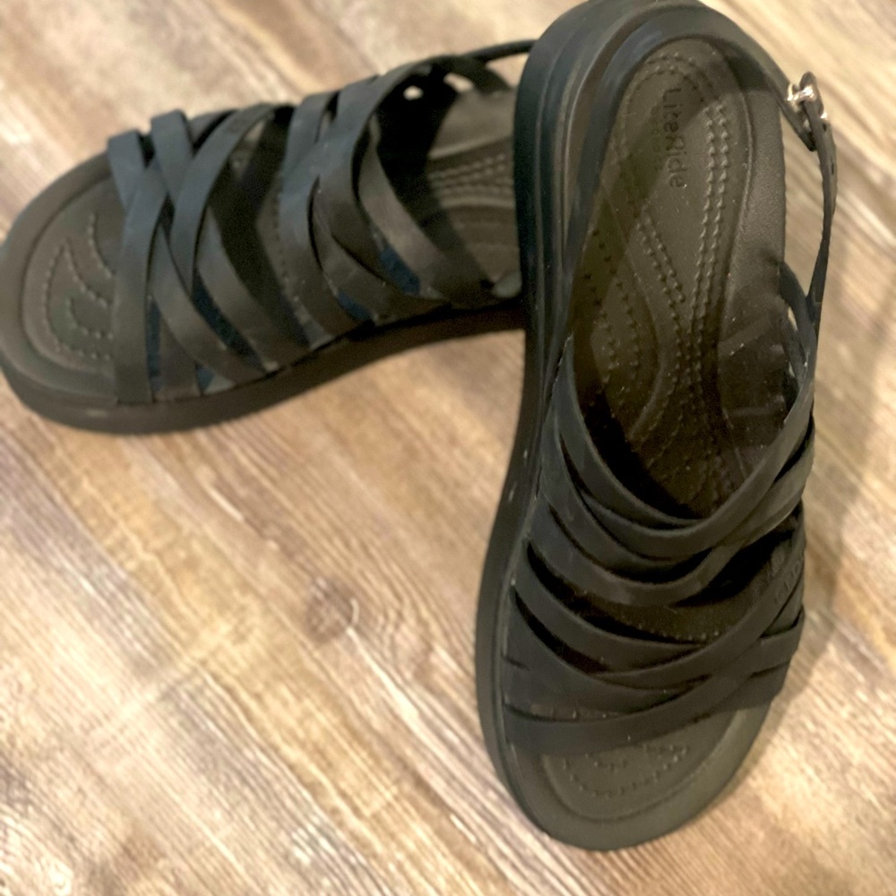 Black platform crocs.
